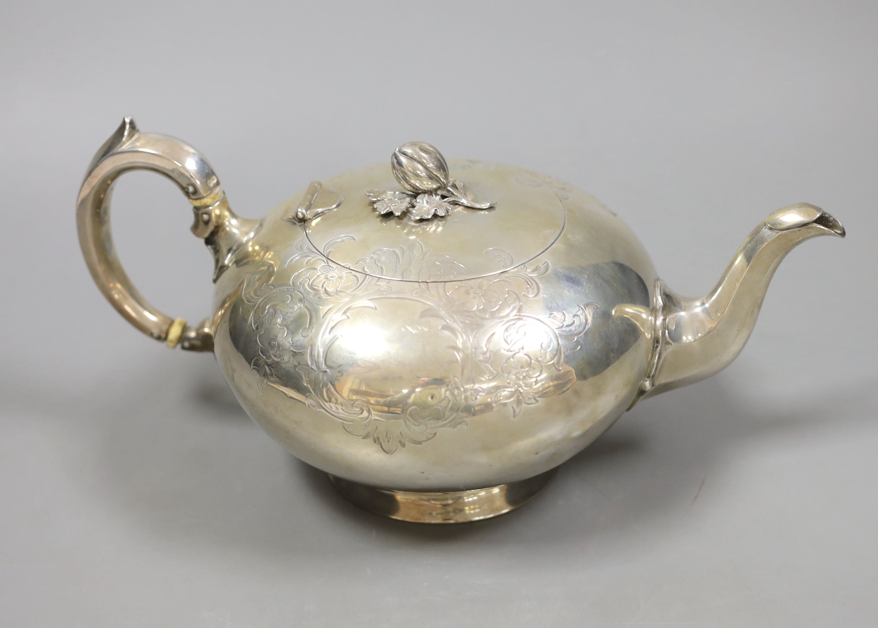 A Victorian engraved silver teapot by William Robert Smily, London, 1952